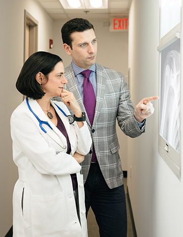 A doctor talk to their patient about therapeutic injections